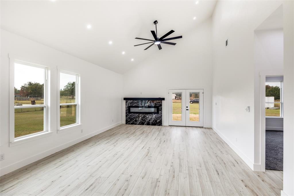 2125 Rs County Road 3150 Emory, TX 75440 - Photo 13 of 40 wooden floor in an empty room with a window