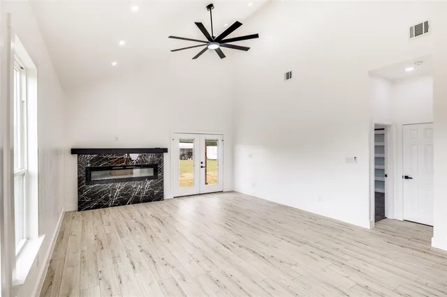 a view of an empty room and a window