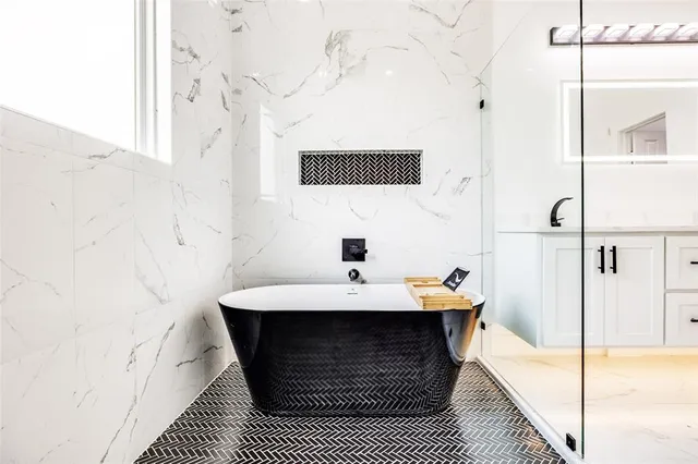 a view of a kitchen with a sink and a refrigerator