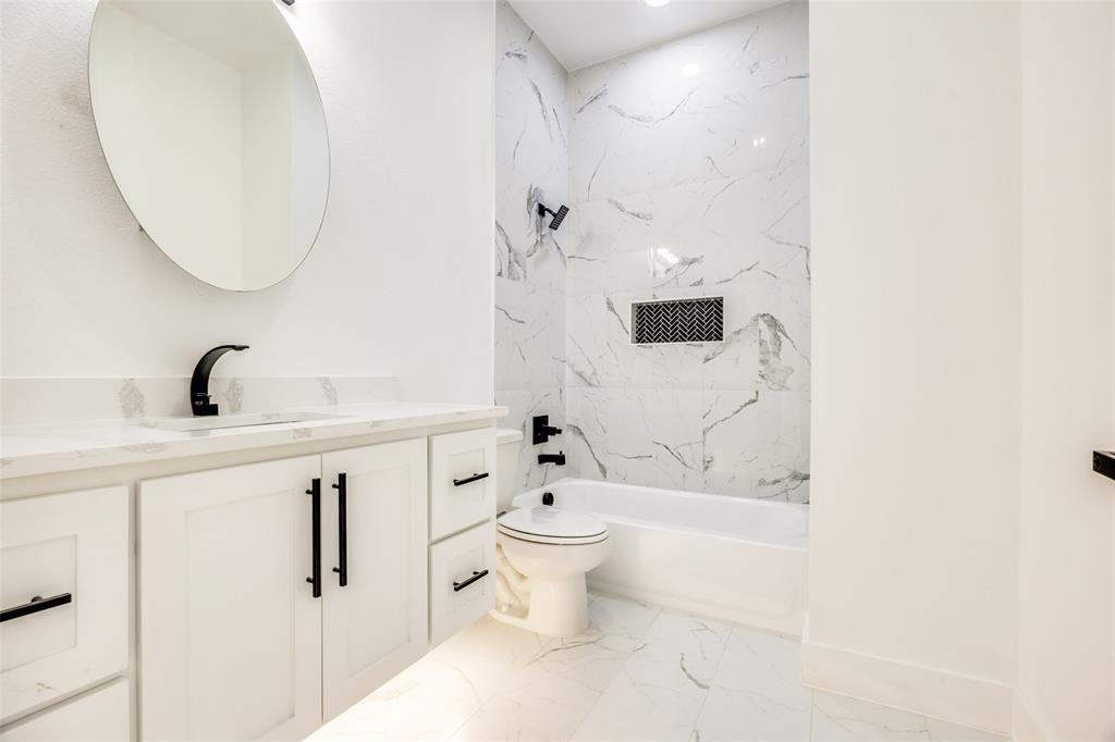 2125 Rs County Road 3150 Emory, TX 75440 - Photo 25 of 40 a bathroom with a sink a toilet and shower