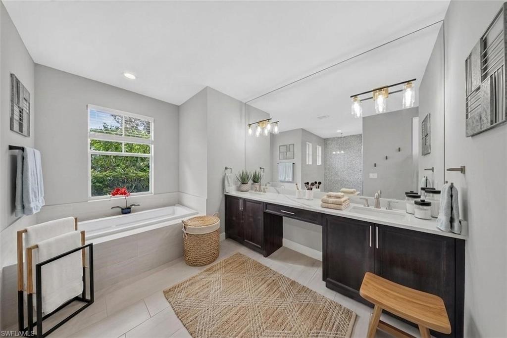 37 Johnnycake Drive Naples, FL 34110 - Photo 6 of 33 Expansive room featuring a tray ceiling with recessed lighting and a ceiling fan