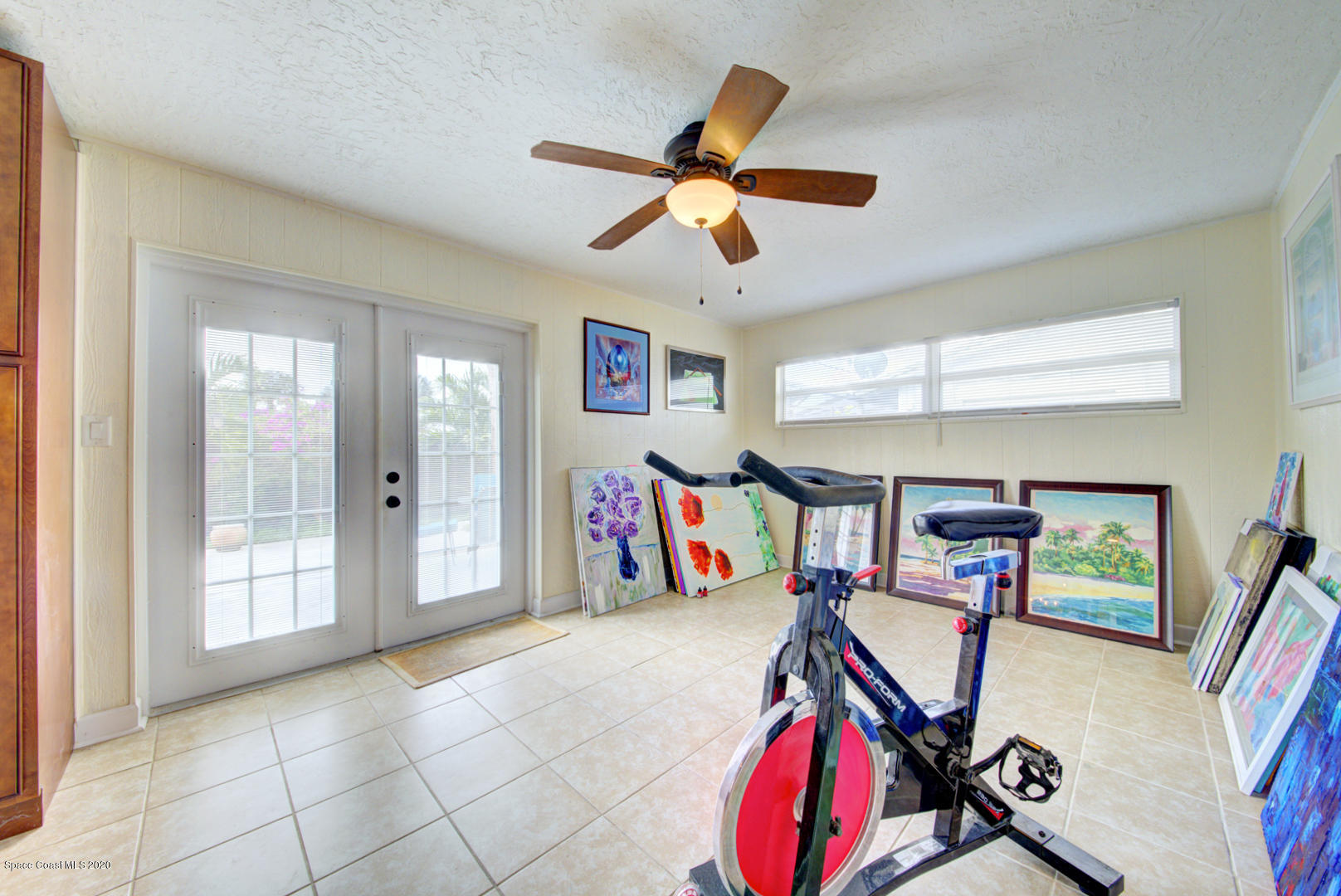 907 Jefferson Road Rockledge, FL 32955 - Photo 14 of 32 den with french doors to pool area
