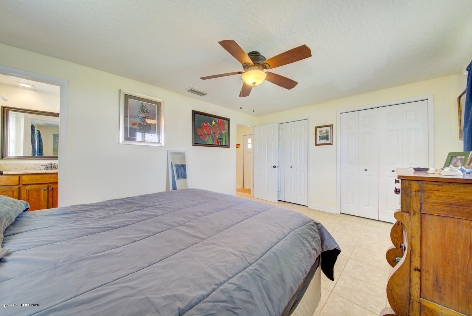 907 Jefferson Road Rockledge, FL 32955 - Photo 18 of 32 master bedroom with ensuite