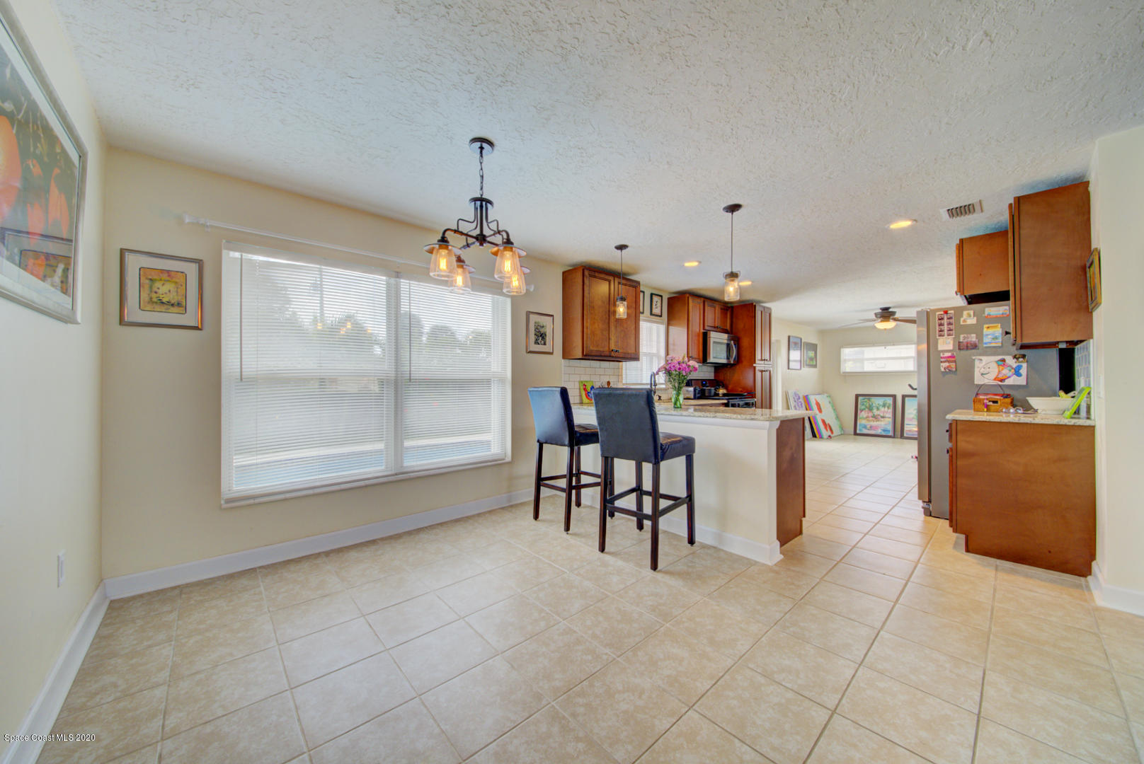 907 Jefferson Road Rockledge, FL 32955 - Photo 8 of 32 dining area open to kitchen