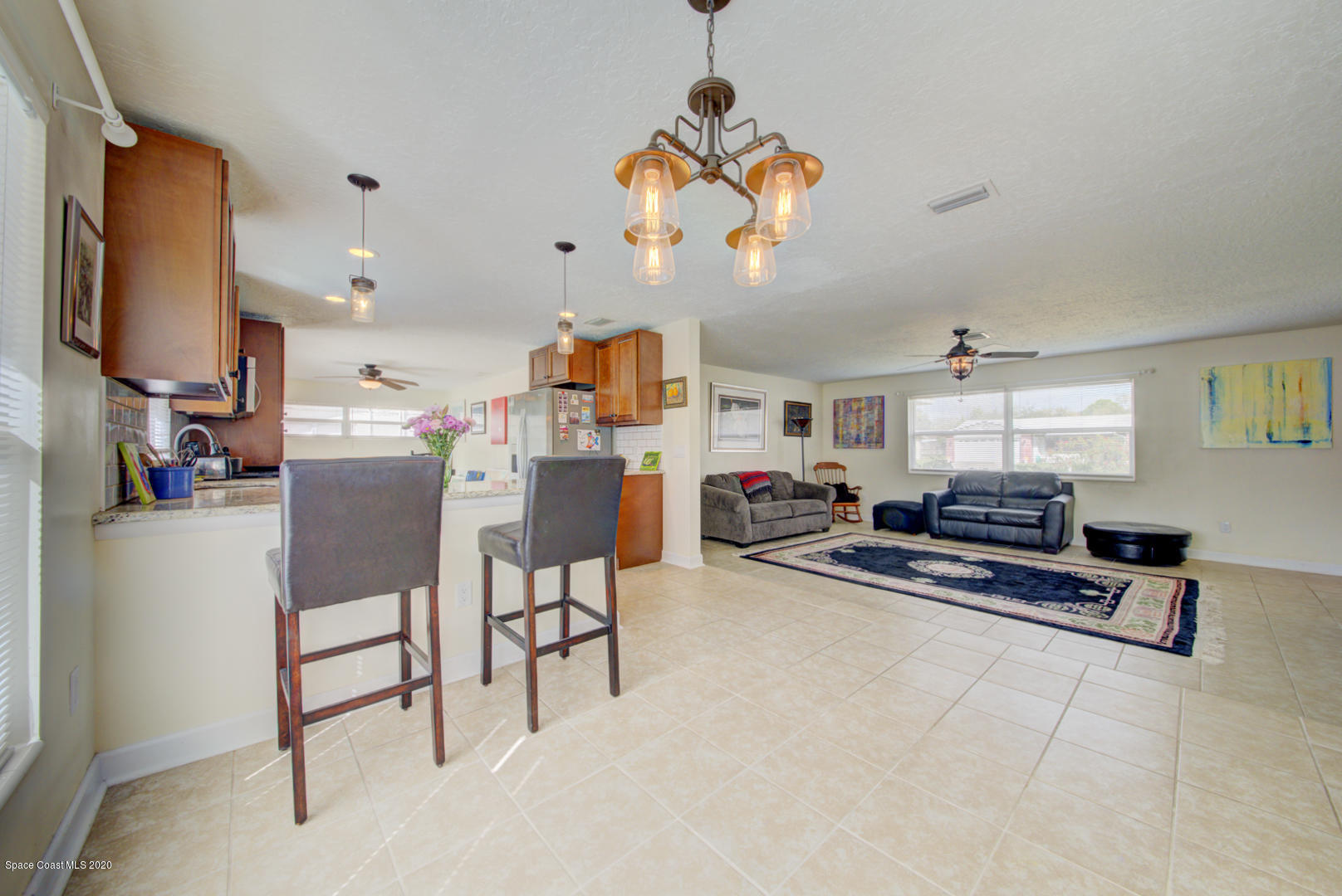 907 Jefferson Road Rockledge, FL 32955 - Photo 9 of 32 dining area with chandelier
