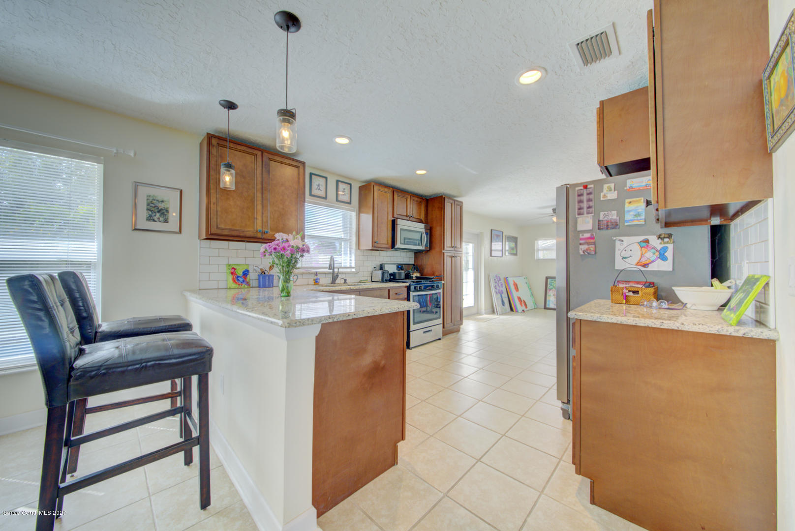907 Jefferson Road Rockledge, FL 32955 - Photo 10 of 32 kitchen with breakfast bar
