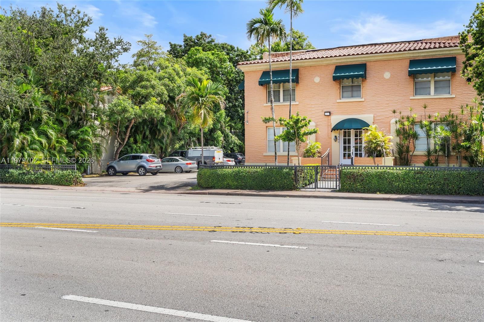 3409 South Le Jeune Road Coral Gables, FL 33134 - Photo 28 of 53 front view of a house with a yard