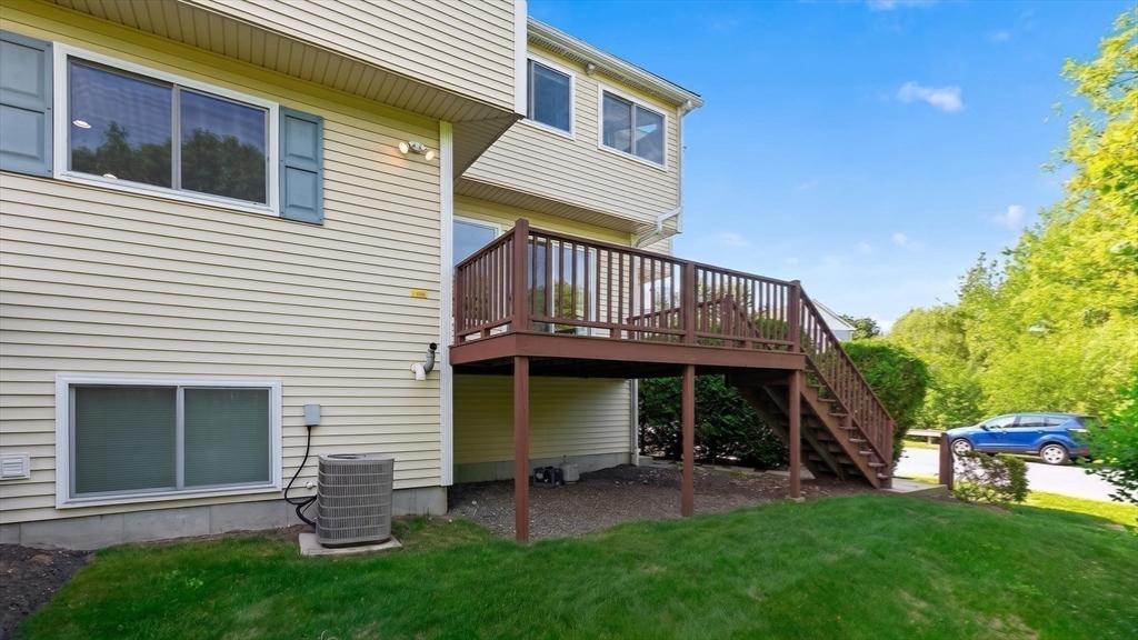 5 Governors Way, Unit B Milford, MA 01757 - Photo 35 of 42 a view of a house with a yard and sitting area