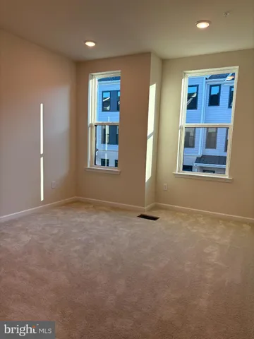 an empty room with closet area