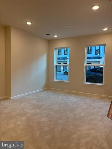 a couple of cars parked in front of a building