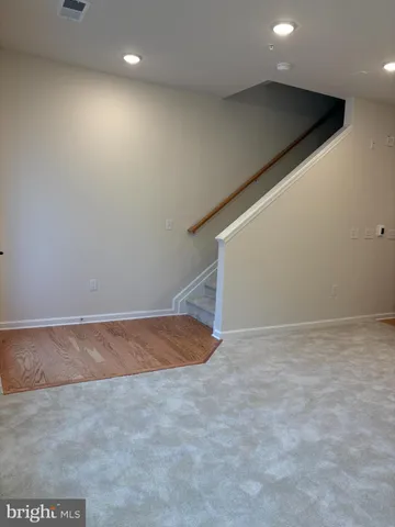 a kitchen with granite countertop a sink a stove and cabinets