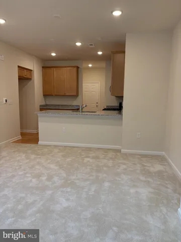 a kitchen with a stove a sink and a microwave