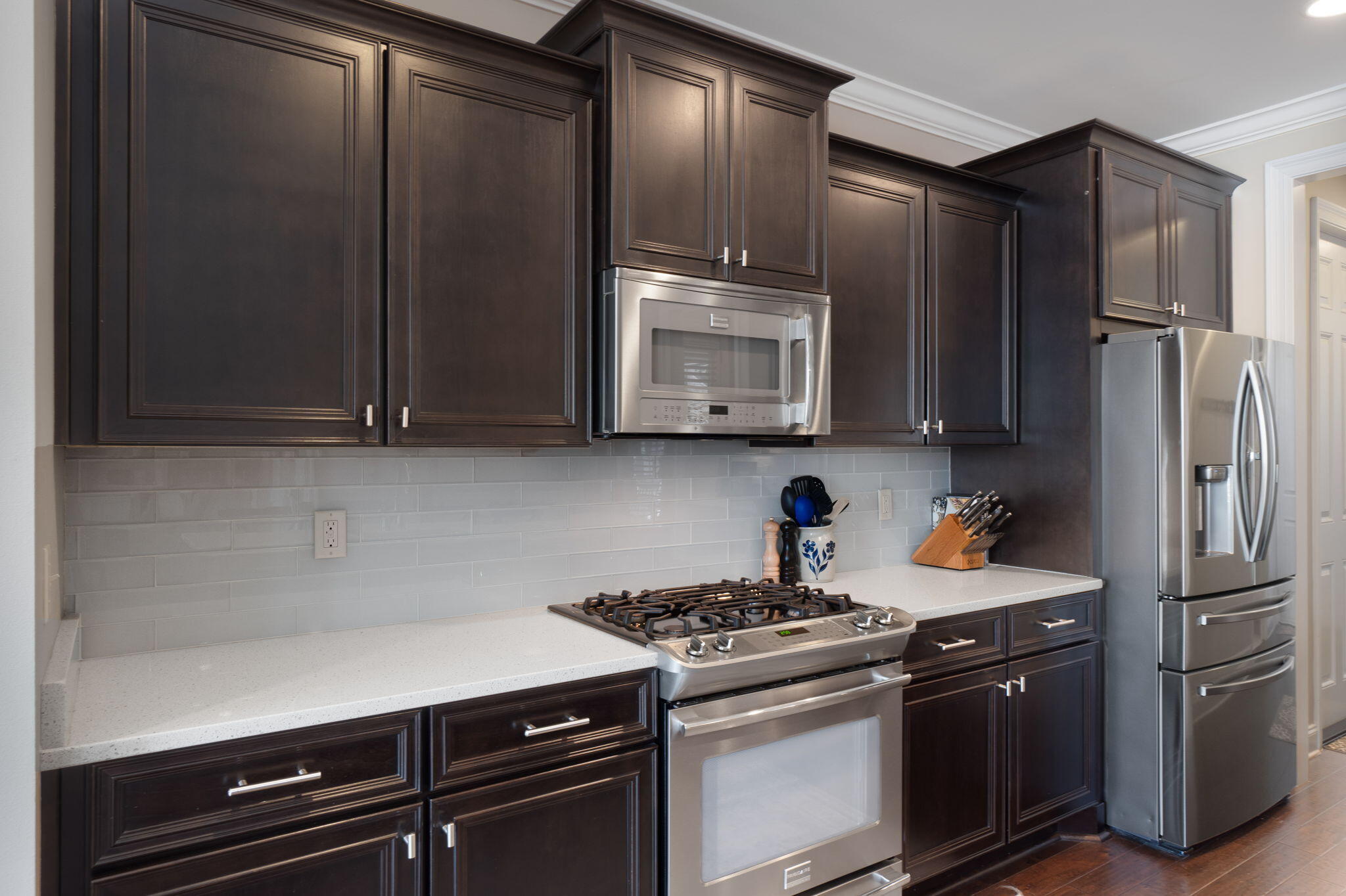 32 Derby Downs Circle Niceville, FL 32578 - Photo 16 of 62 a kitchen with stainless steel appliances wooden cabinets and a stove top oven