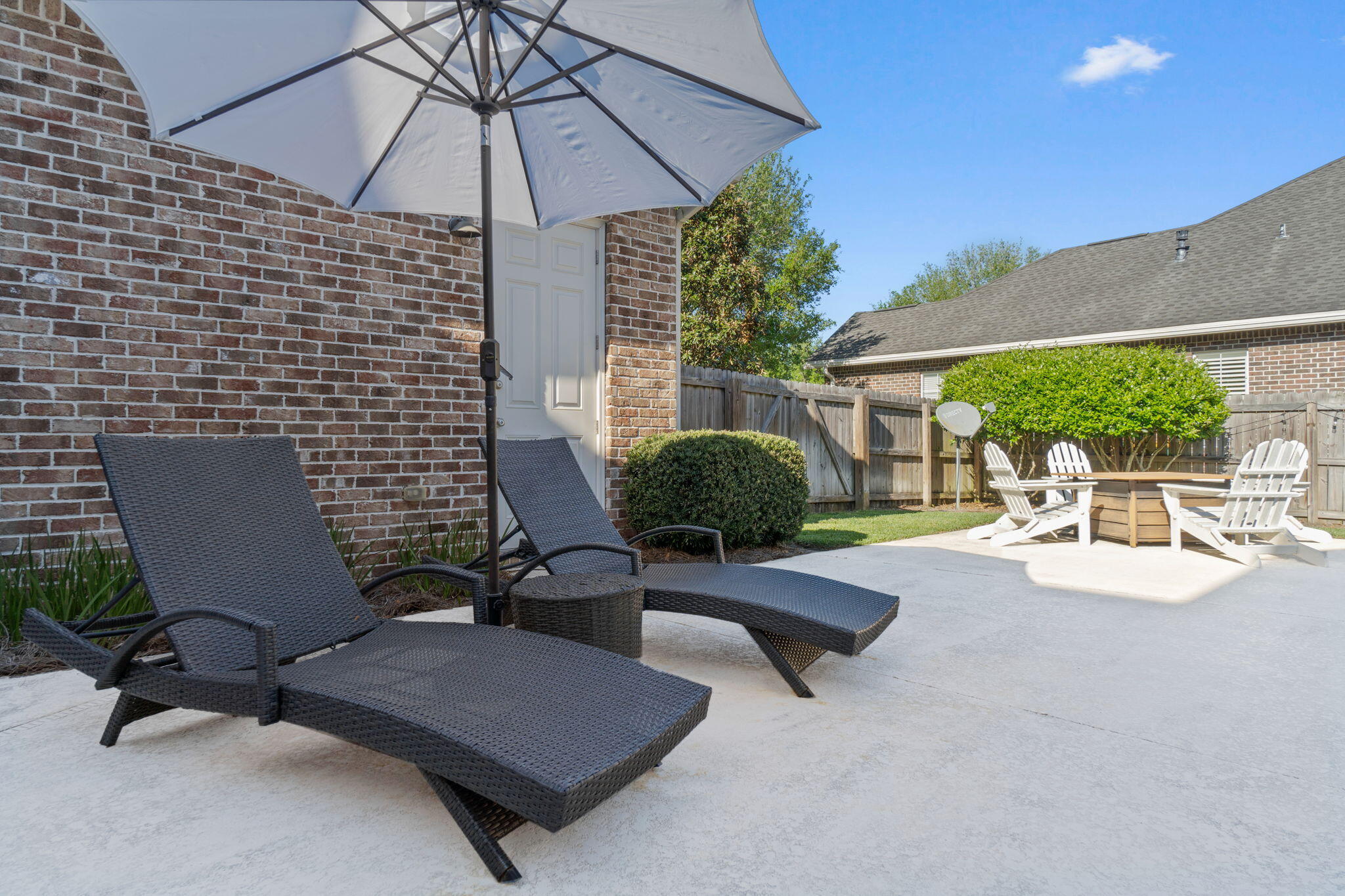 32 Derby Downs Circle Niceville, FL 32578 - Photo 48 of 62 a view of a patio with a table and chairs under an umbrella