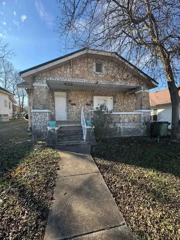 a view of a back yard of the house