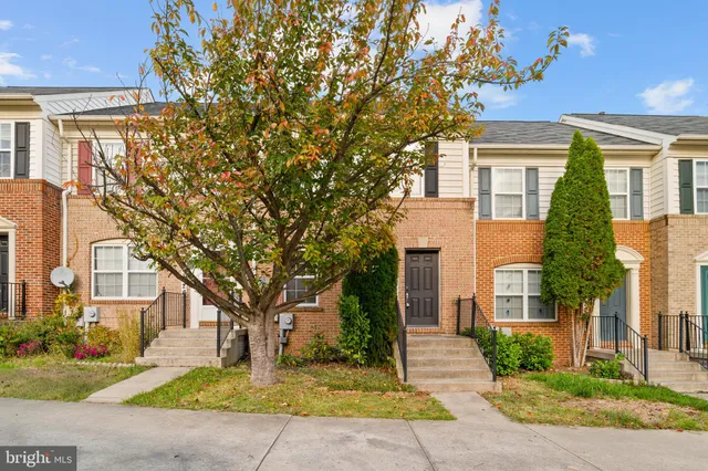 a kitchen with stainless steel appliances granite countertop a stove a sink dishwasher a refrigerator and a microwave