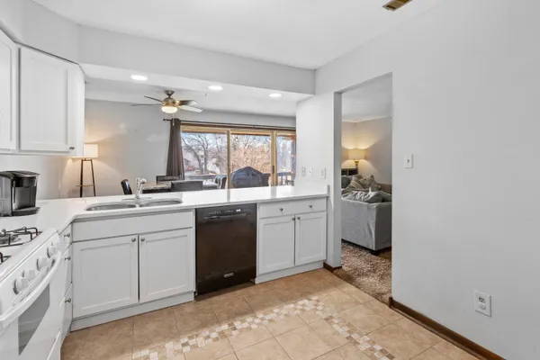a kitchen with a sink cabinets and stainless steel appliances