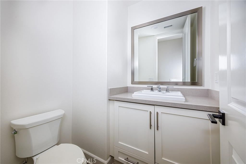 2017 Picasso Santa Ana, CA 92704 - Photo 18 of 31 a bathroom with a granite countertop toilet sink and mirror
