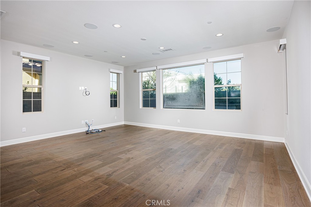 2017 Picasso Santa Ana, CA 92704 - Photo 7 of 31 a view of an empty room with wooden floor and a window