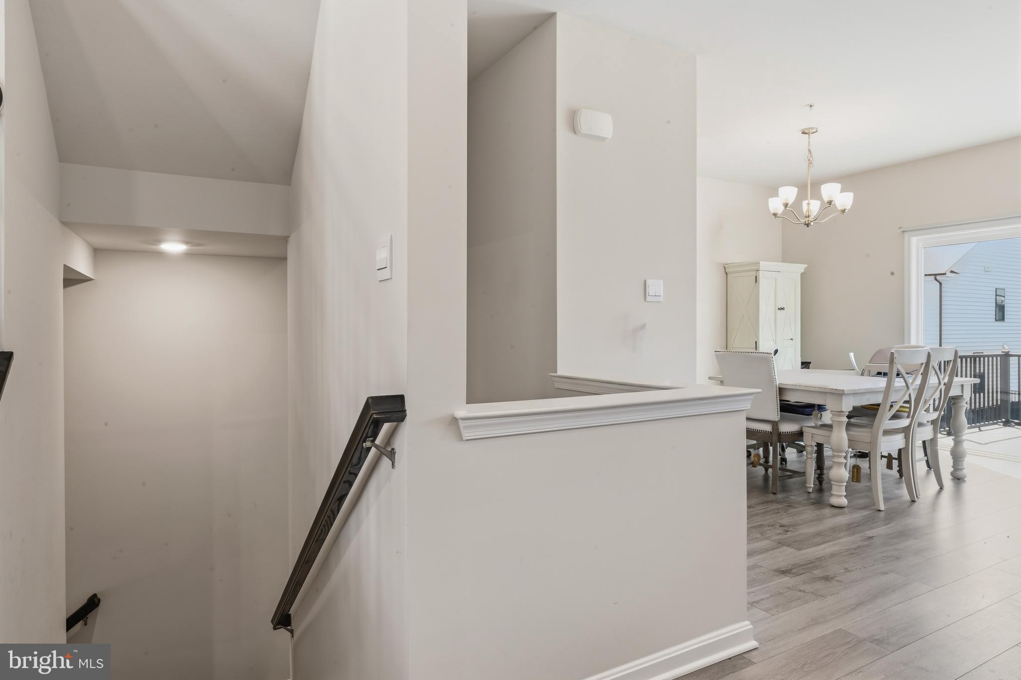 870 Amity Street Frederick, MD 21701 - Photo 11 of 56 a view of a dining room with furniture and wooden floor