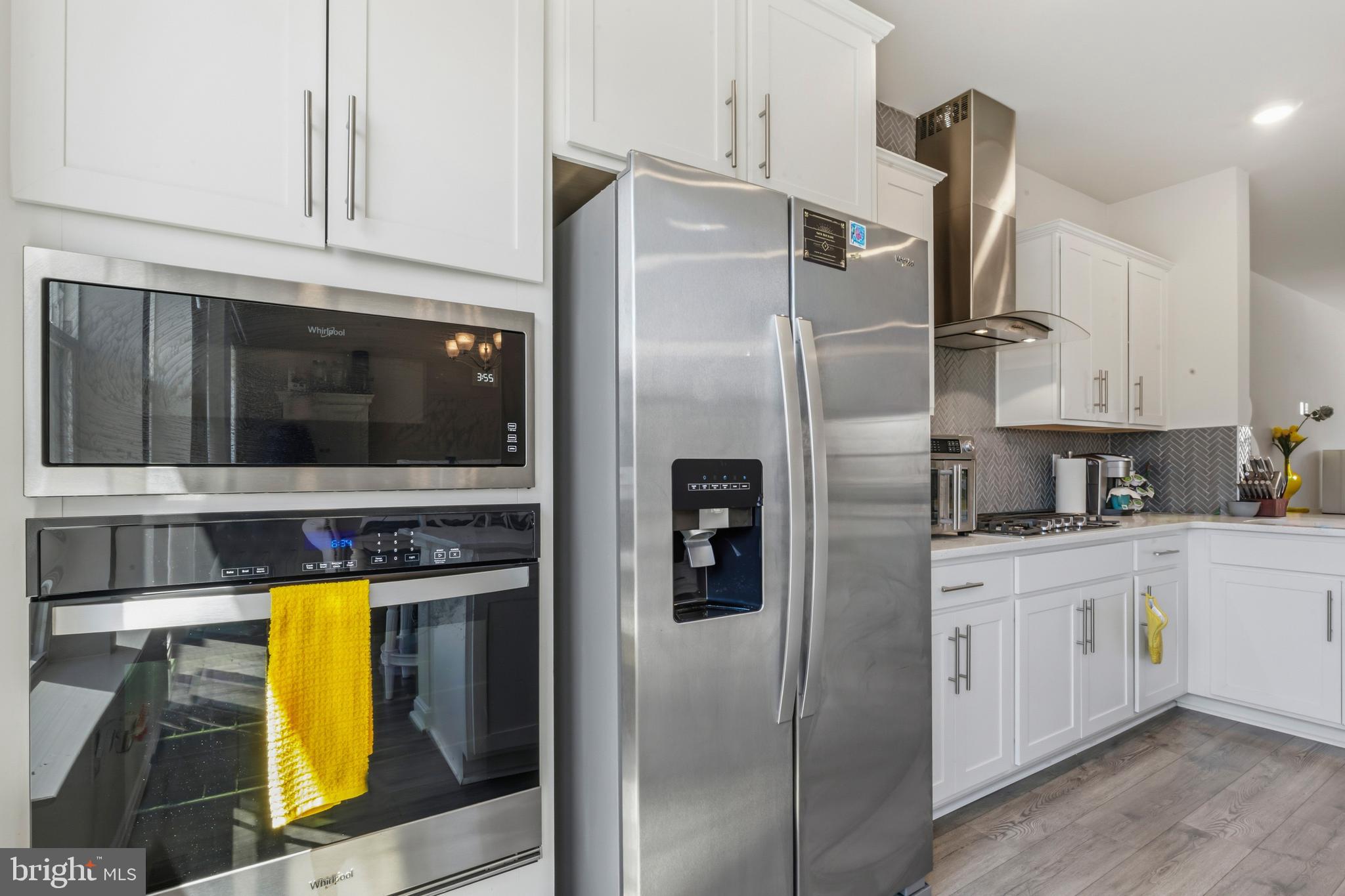 870 Amity Street Frederick, MD 21701 - Photo 18 of 56 a kitchen with stainless steel appliances a refrigerator and a stove