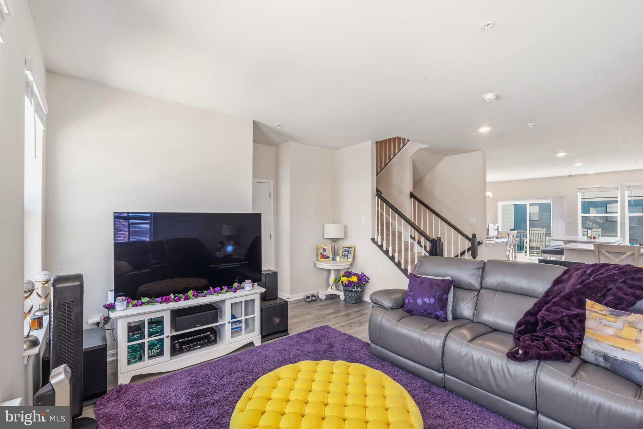 870 Amity Street Frederick, MD 21701 - Photo 26 of 56 a living room with furniture and a flat screen tv