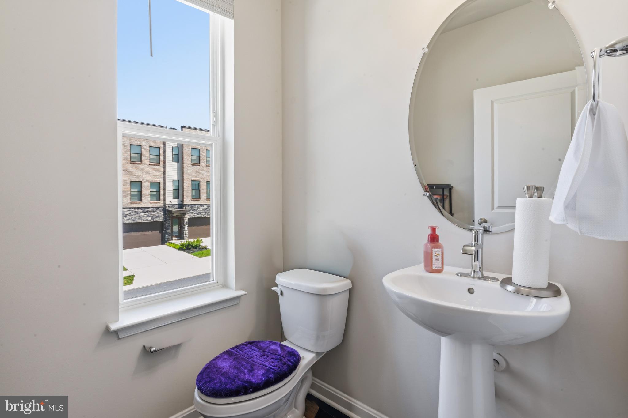 870 Amity Street Frederick, MD 21701 - Photo 27 of 56 a bathroom with a sink toilet and a mirror
