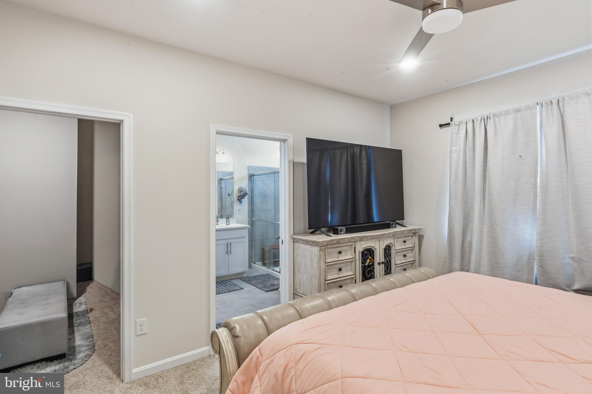 870 Amity Street Frederick, MD 21701 - Photo 33 of 56 a bedroom with a bed and a television