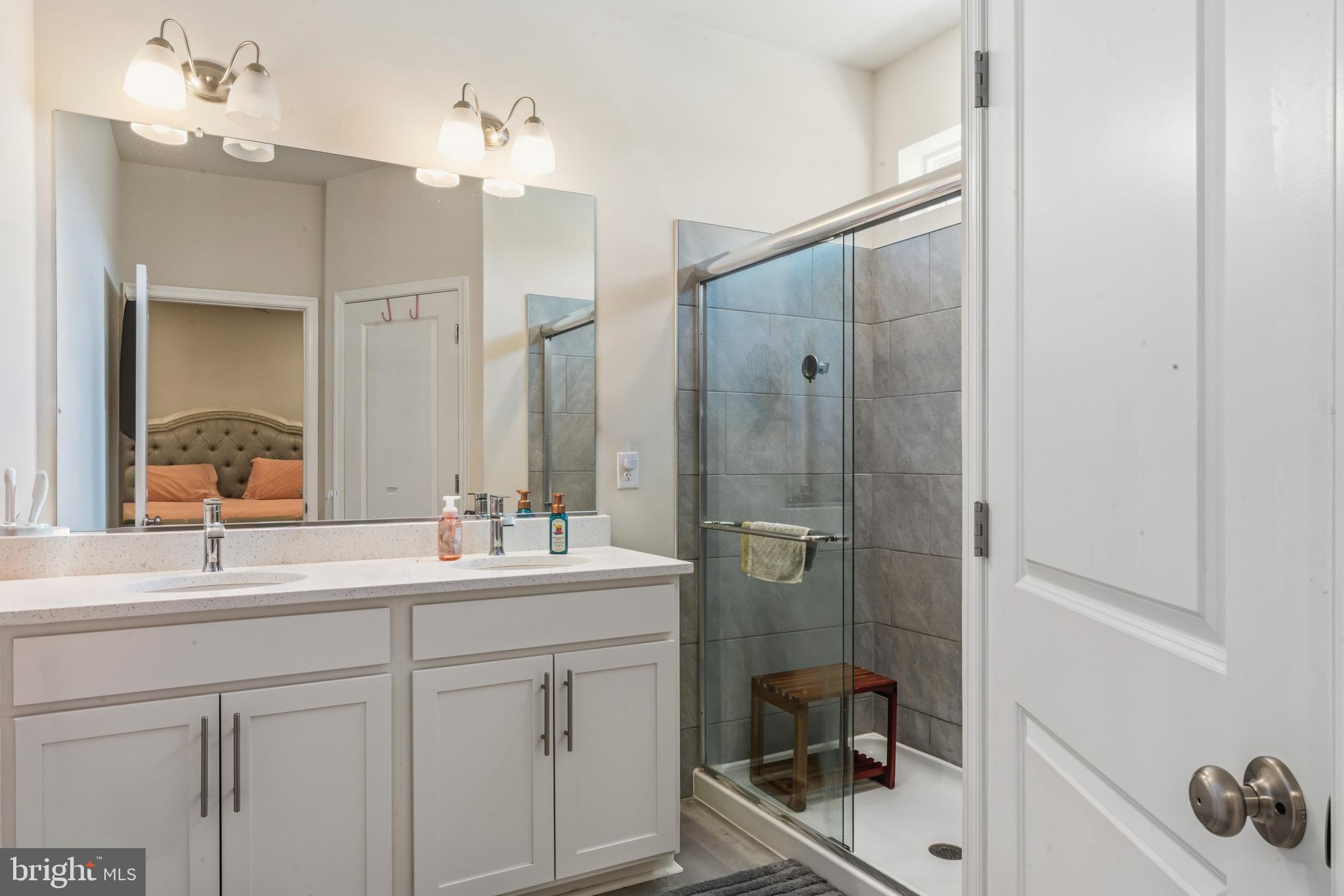 870 Amity Street Frederick, MD 21701 - Photo 35 of 56 a bathroom with a double vanity sink mirror and double