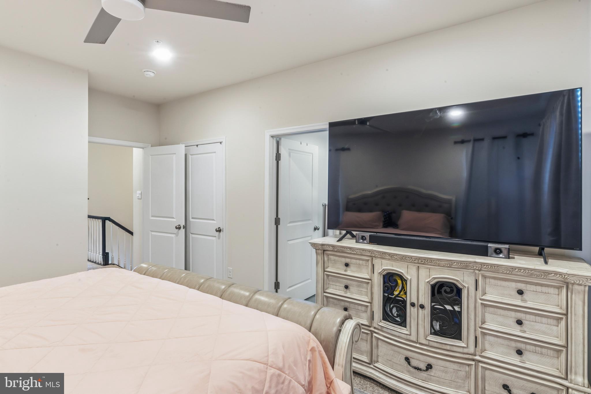 870 Amity Street Frederick, MD 21701 - Photo 38 of 56 a bedroom with a bed and a dresser