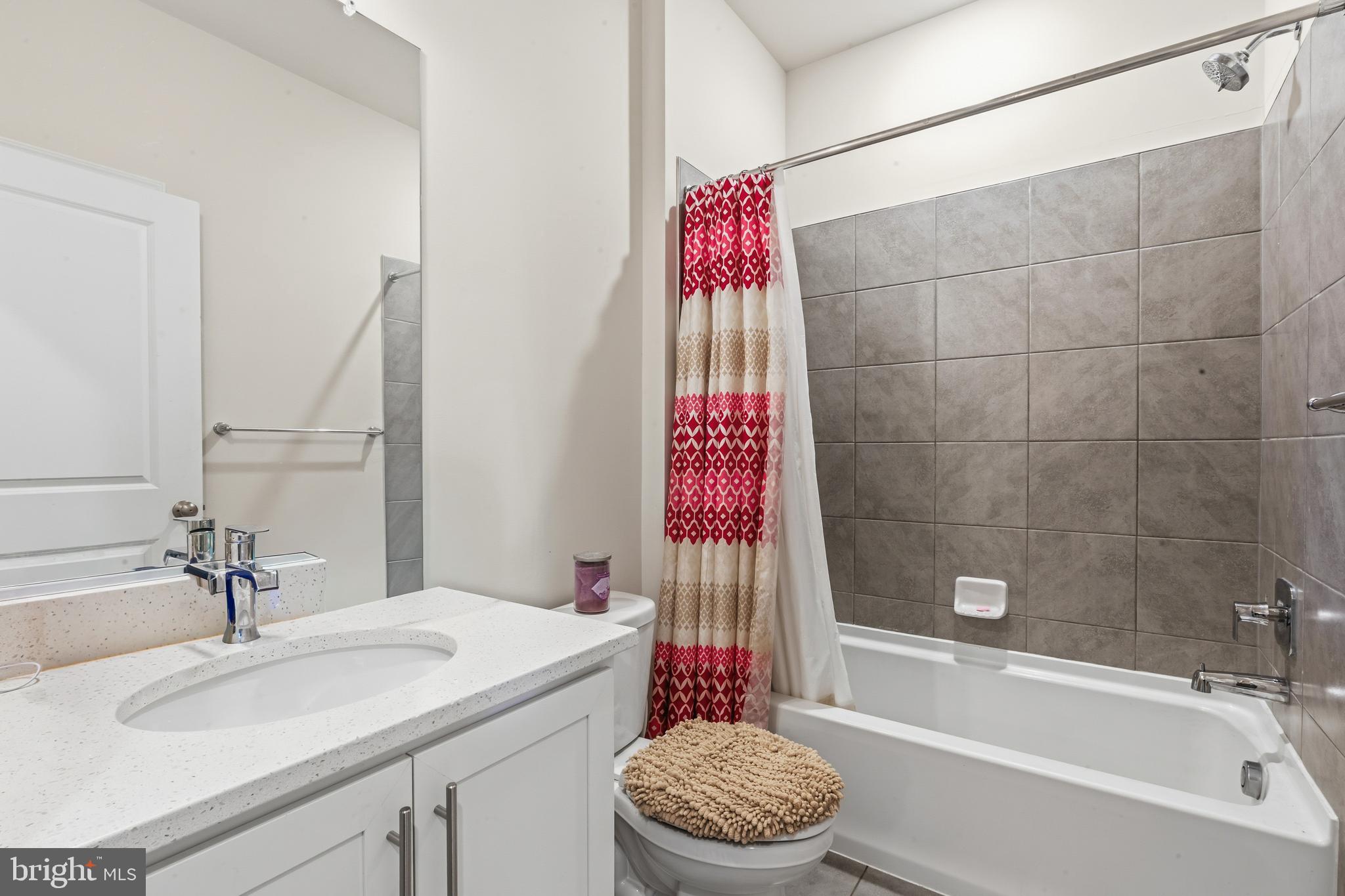 870 Amity Street Frederick, MD 21701 - Photo 40 of 56 a bathroom with a sink toilet and shower