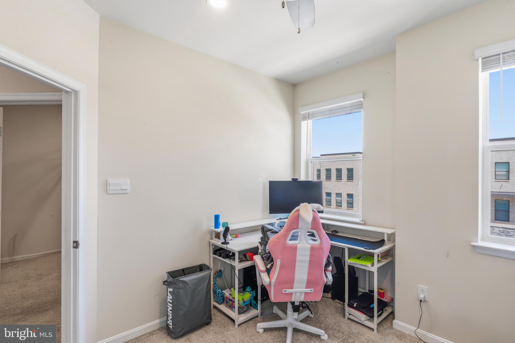 870 Amity Street Frederick, MD 21701 - Photo 44 of 56 a view of a workspace with furniture and a window