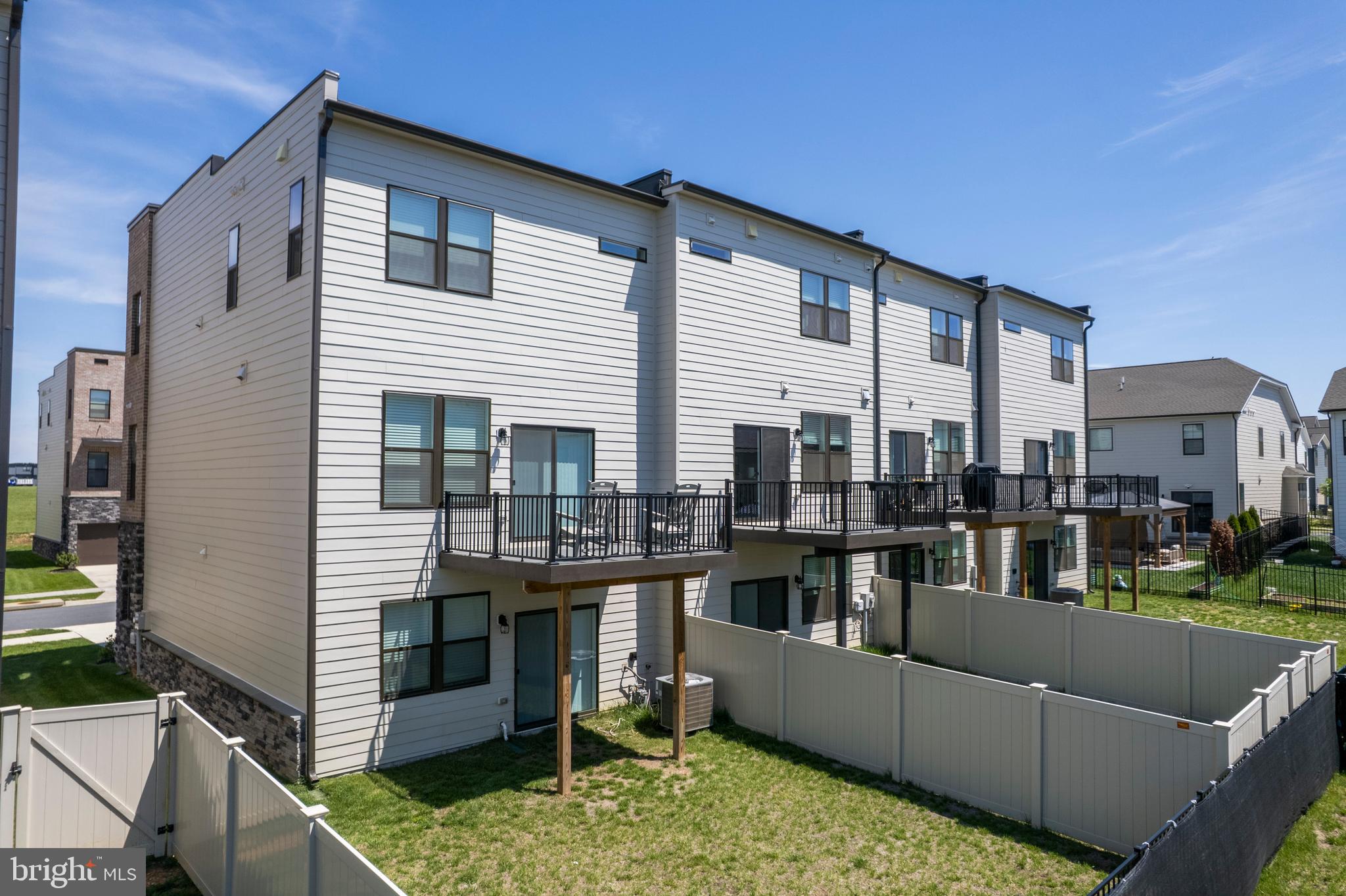 870 Amity Street Frederick, MD 21701 - Photo 50 of 56 a balcony with furniture and a fireplace