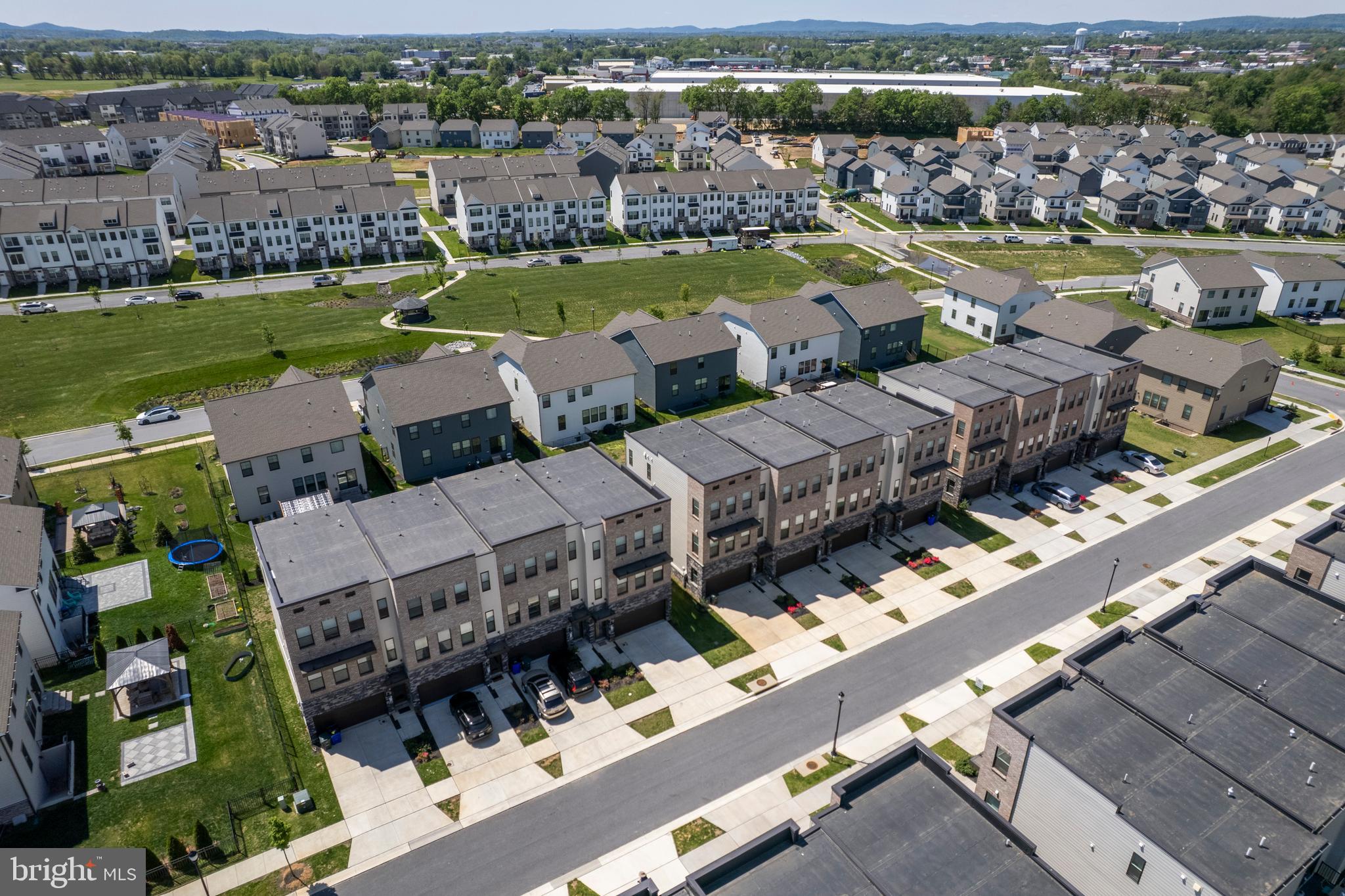 870 Amity Street Frederick, MD 21701 - Photo 53 of 56 an aerial view of a city with lots of residential buildings ocean and mountain view in back