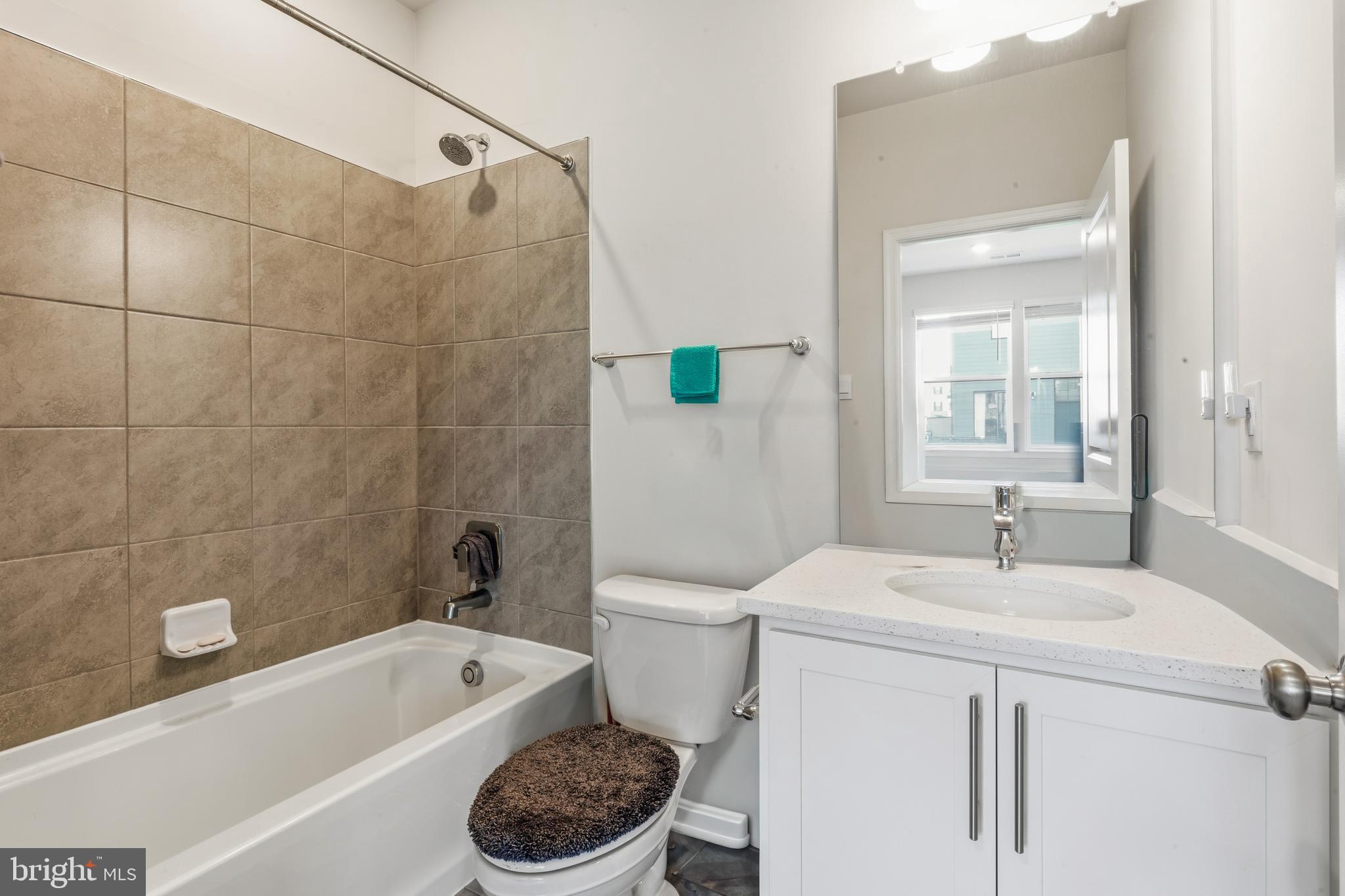 870 Amity Street Frederick, MD 21701 - Photo 10 of 56 a bathroom with a sink a toilet and a bathtub
