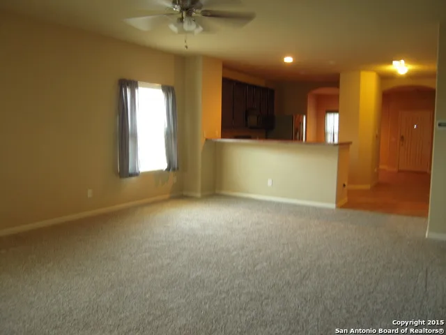 a view of an empty room with a window