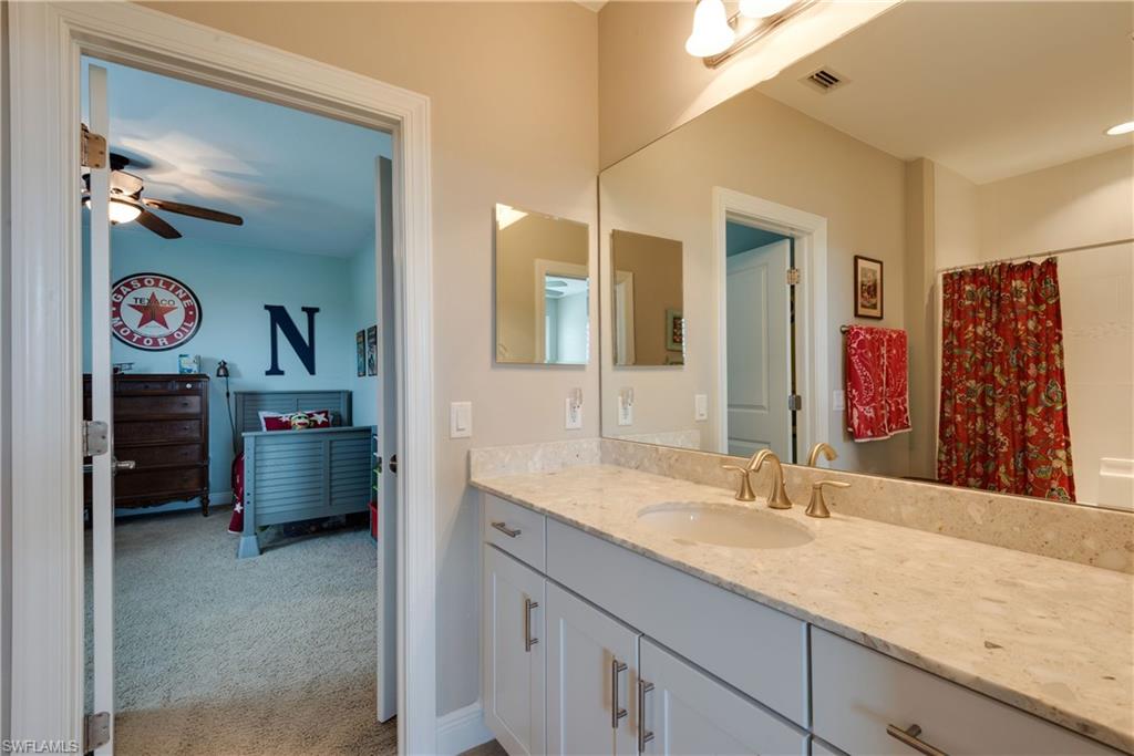 4068 Raffia Drive Naples, FL 34119 - Photo 18 of 25 There are two full bathrooms upstairs, one of them being a jack and jill bath layout.