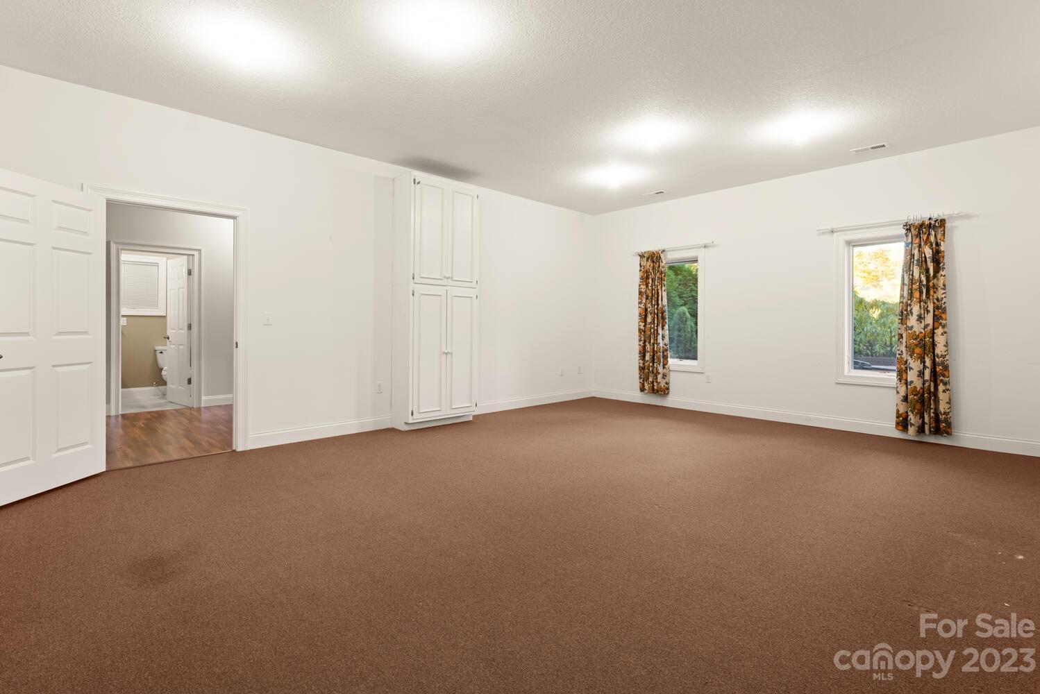 42 Country Club Road Mills River, NC 28759 - Photo 25 of 48 an empty room with windows