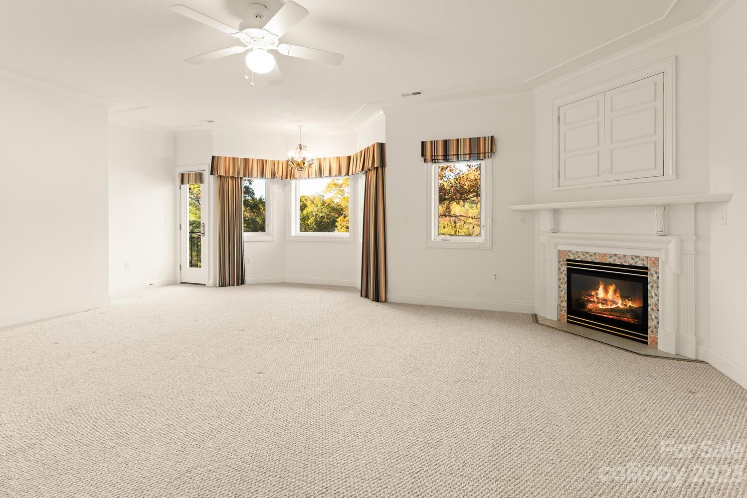 42 Country Club Road Mills River, NC 28759 - Photo 30 of 48 a view of an empty room with a fireplace and a window