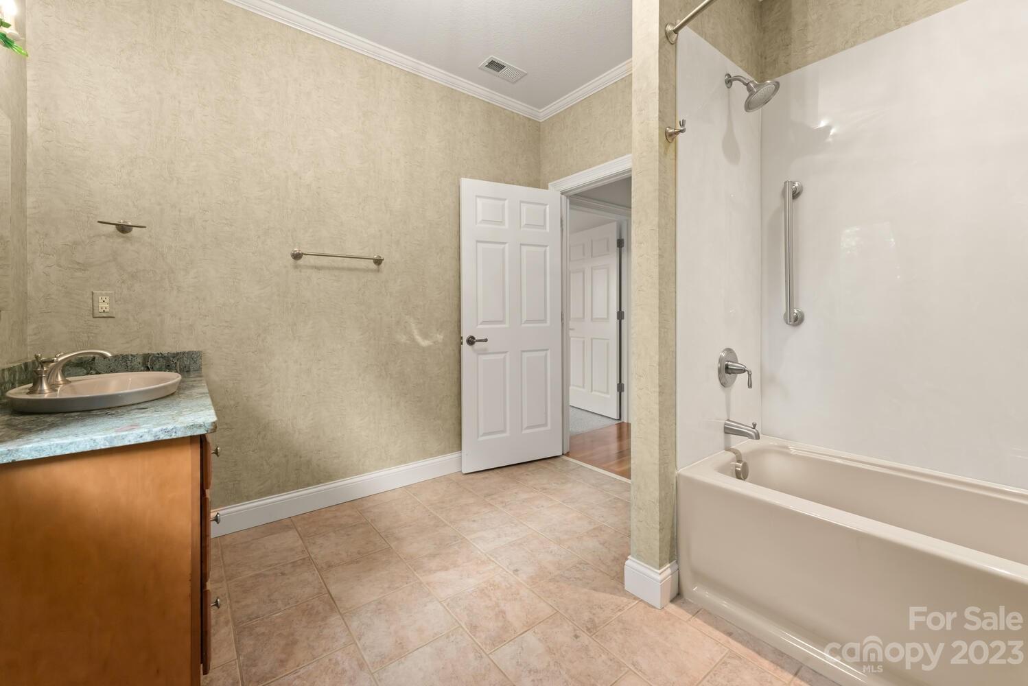 42 Country Club Road Mills River, NC 28759 - Photo 34 of 48 a bathroom with a granite countertop sink a toilet and shower