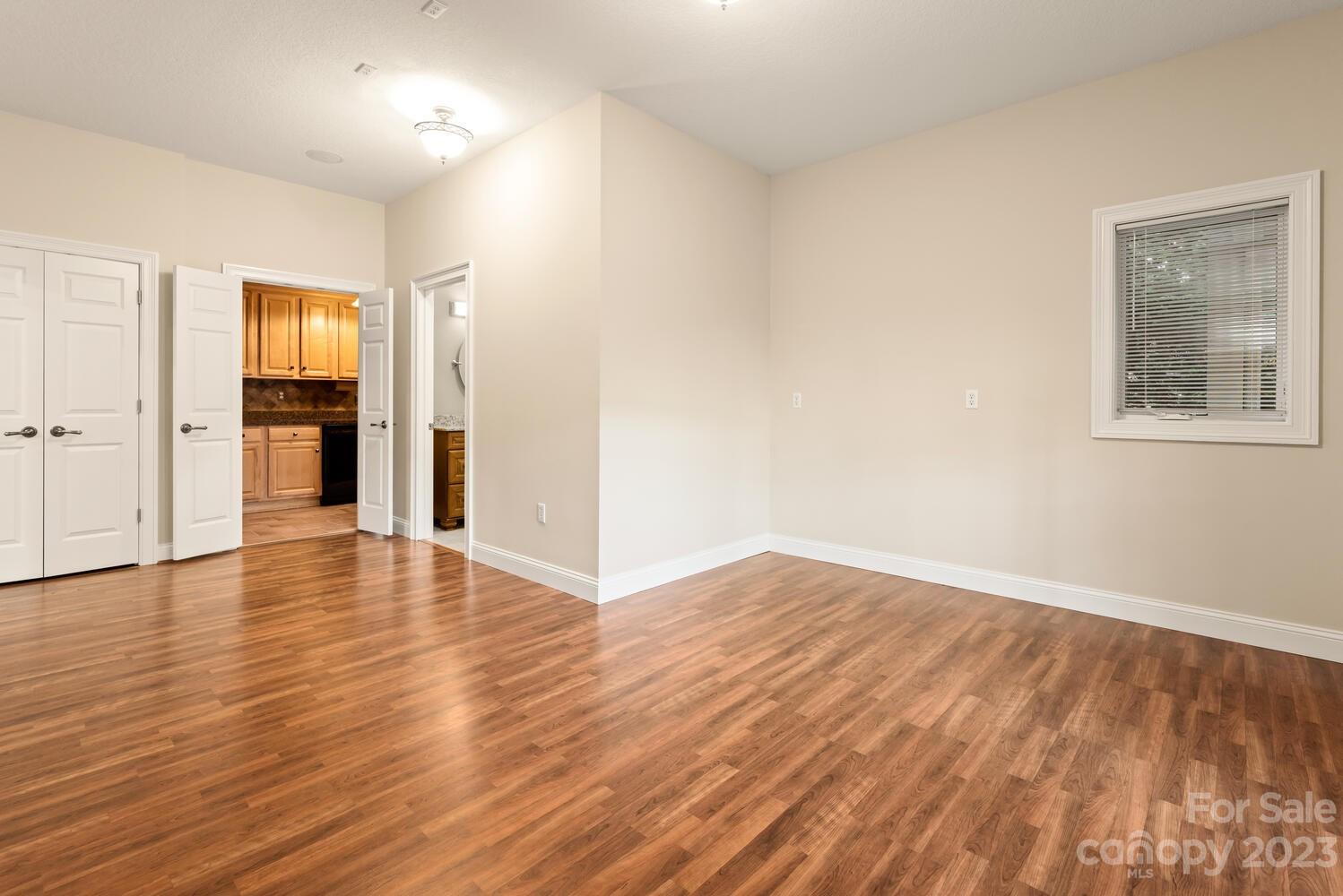 42 Country Club Road Mills River, NC 28759 - Photo 37 of 48 an empty room with wooden floor and closet