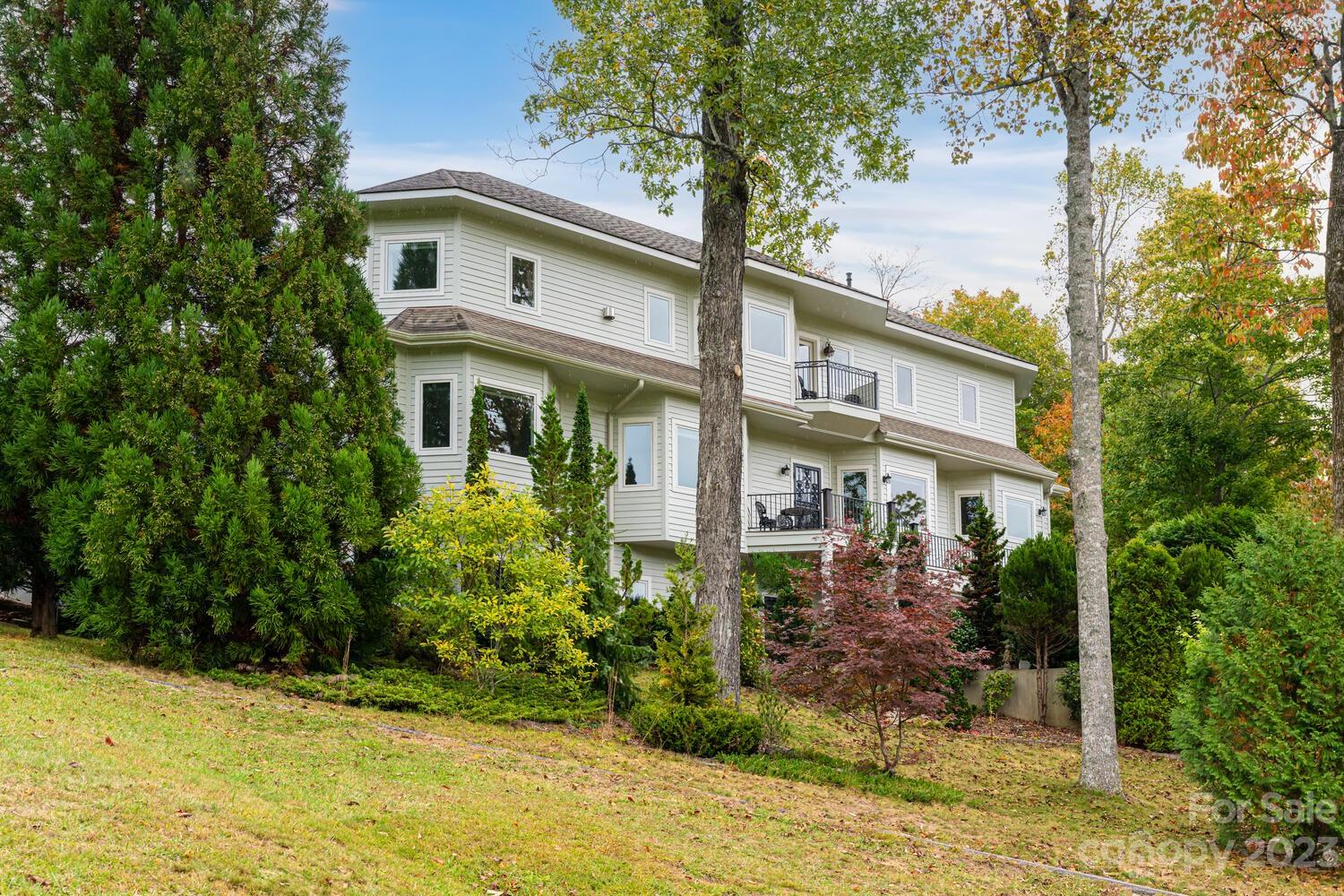 42 Country Club Road Mills River, NC 28759 - Photo 48 of 48 a front view of a house with garden