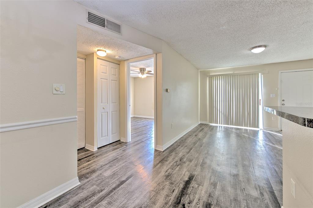 308 Lake Parsons Green, Unit 106 Brandon, FL 33511 - Photo 15 of 26 wooden floor in an empty room with a window
