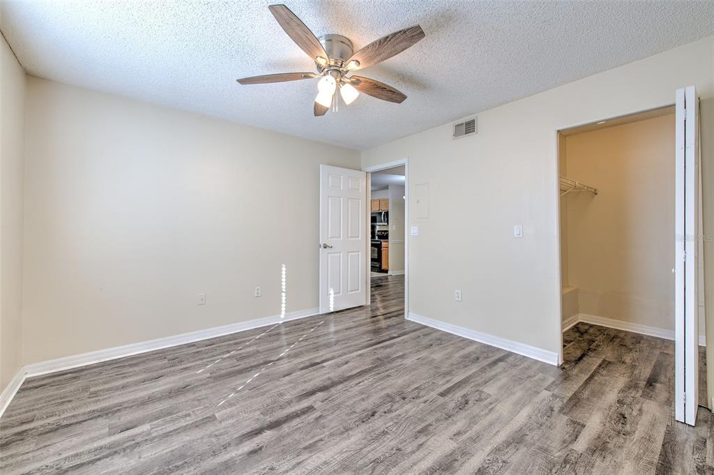 308 Lake Parsons Green, Unit 106 Brandon, FL 33511 - Photo 17 of 26 wooden floor in an empty room