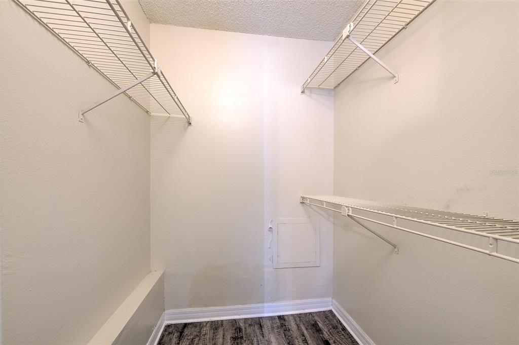 308 Lake Parsons Green, Unit 106 Brandon, FL 33511 - Photo 18 of 26 a view of a room with racks on the wall