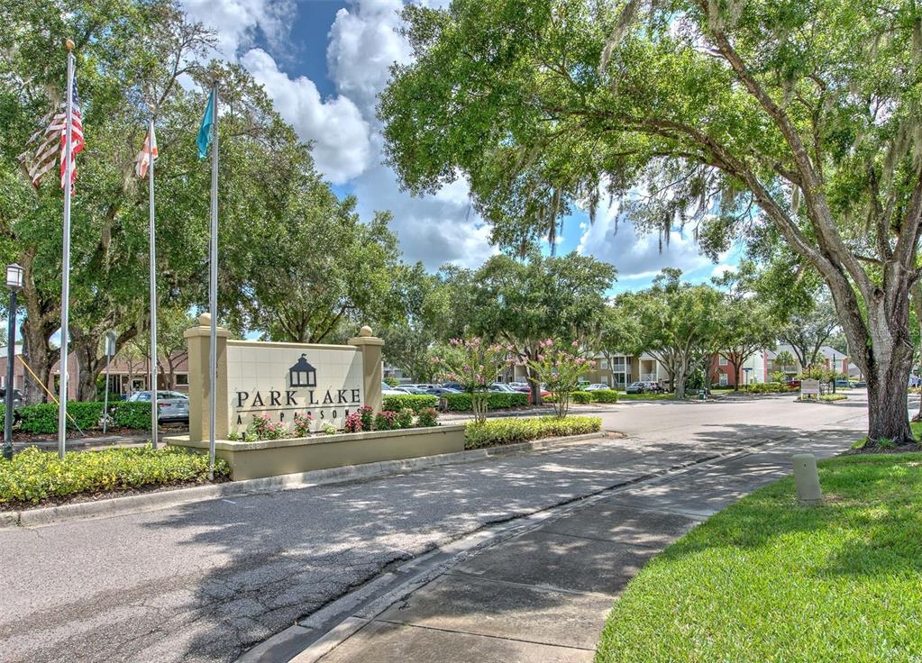 308 Lake Parsons Green, Unit 106 Brandon, FL 33511 - Photo 19 of 26 a sign board with parking space in back