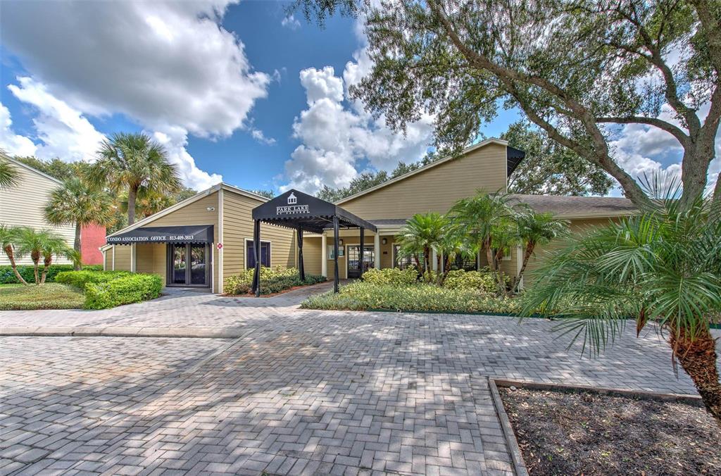 308 Lake Parsons Green, Unit 106 Brandon, FL 33511 - Photo 20 of 26 a front view of a house with garden