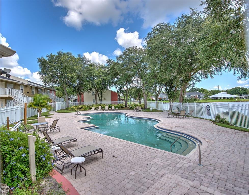 308 Lake Parsons Green, Unit 106 Brandon, FL 33511 - Photo 22 of 26 a view of a backyard with lake view