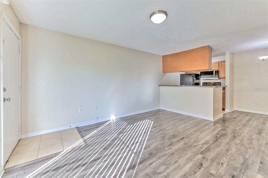 308 Lake Parsons Green, Unit 106 Brandon, FL 33511 - Photo 5 of 26 a view of a kitchen with a sink and a refrigerator