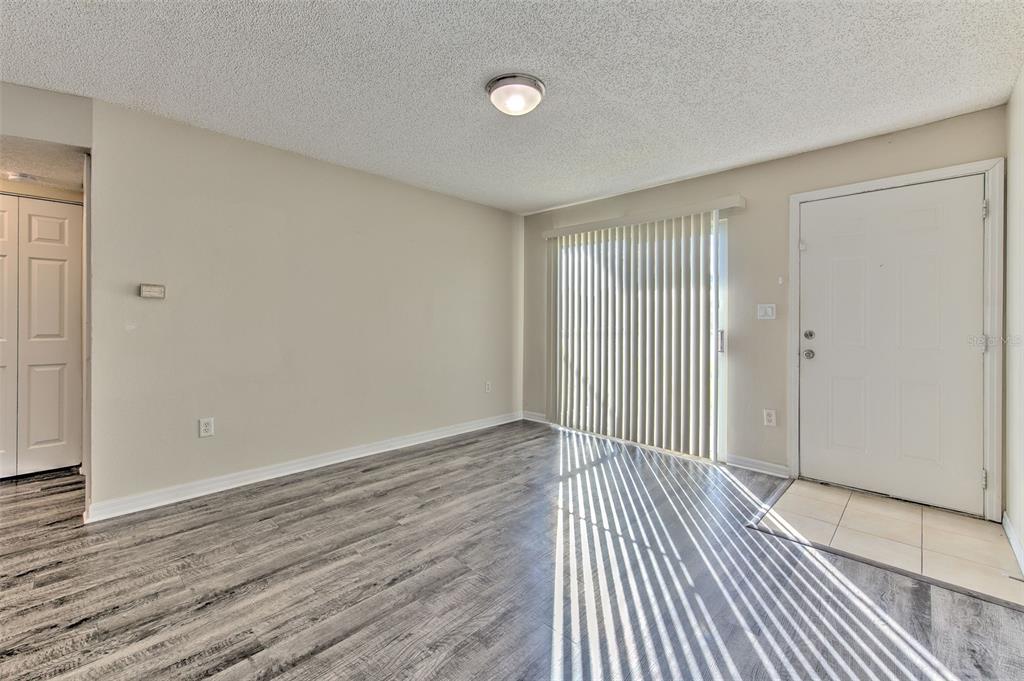 308 Lake Parsons Green, Unit 106 Brandon, FL 33511 - Photo 6 of 26 a view of a room with wooden floor